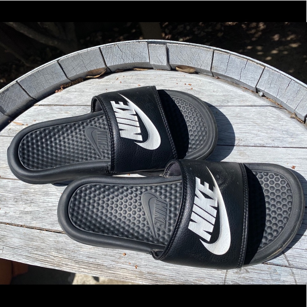 Black and white Nike slides